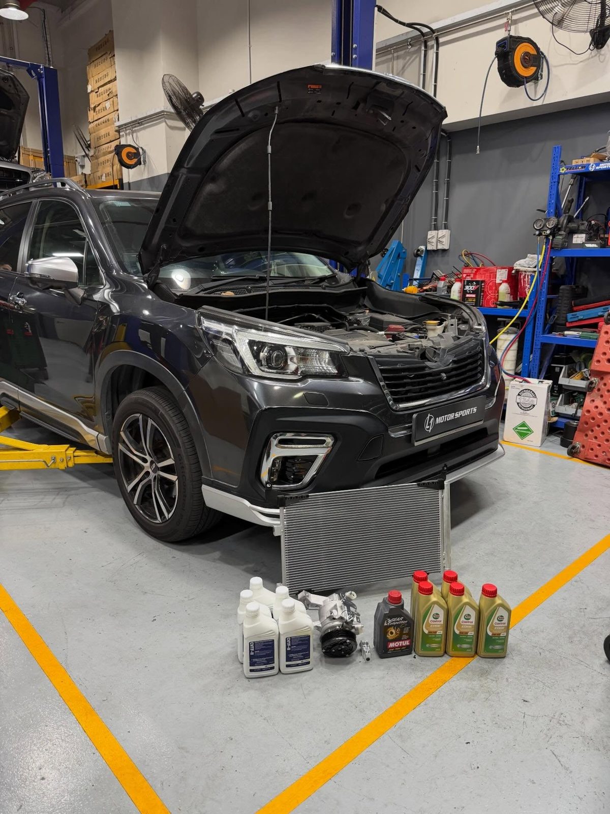 Mercedes-Benz on the lift at L1 Motorsports